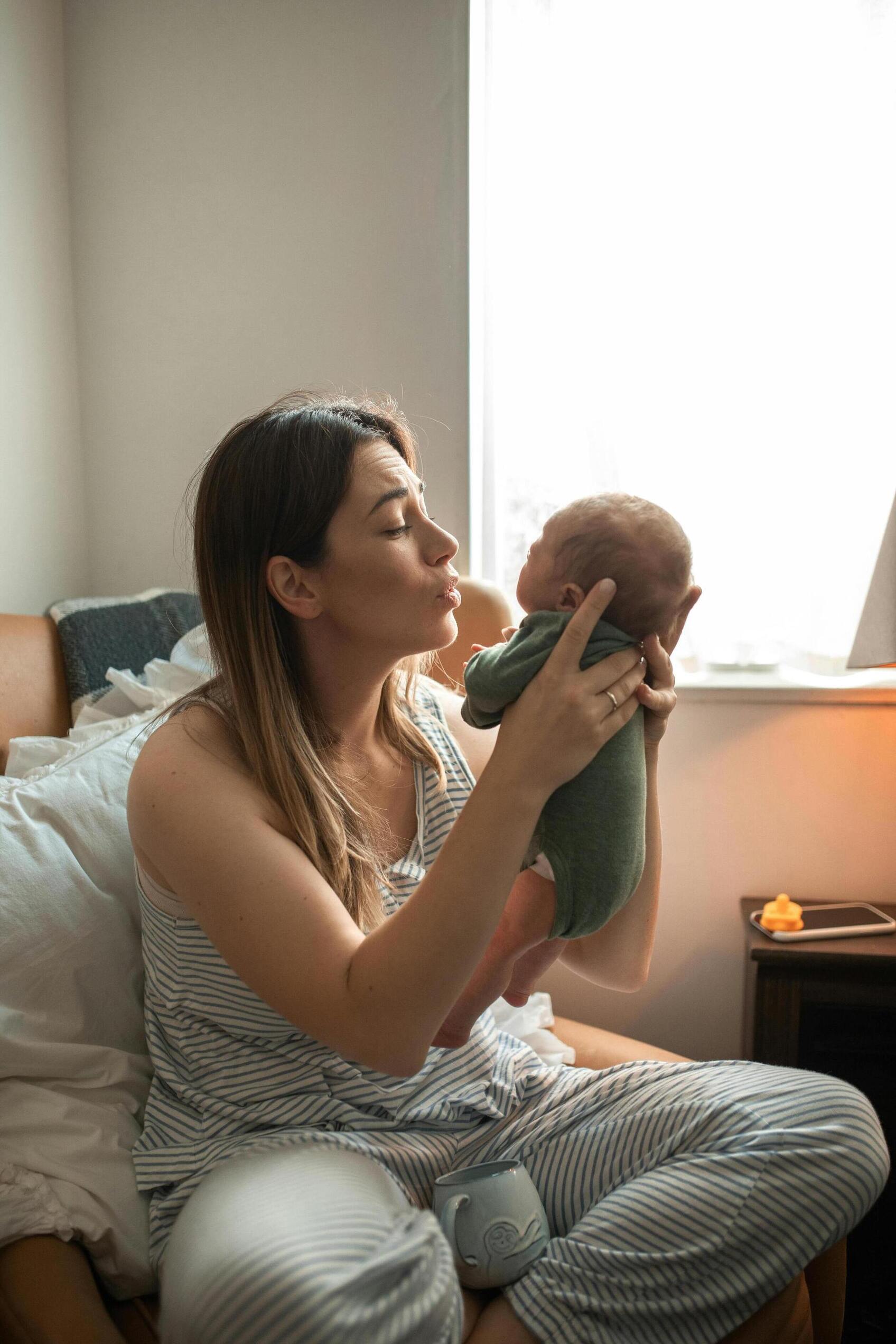 Mother holding newborn baby